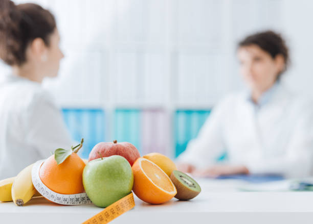 Nurse Practitioner meeting a patient in the office to discuss semaglutide and tirzepatide. Healthy eating and diet concept